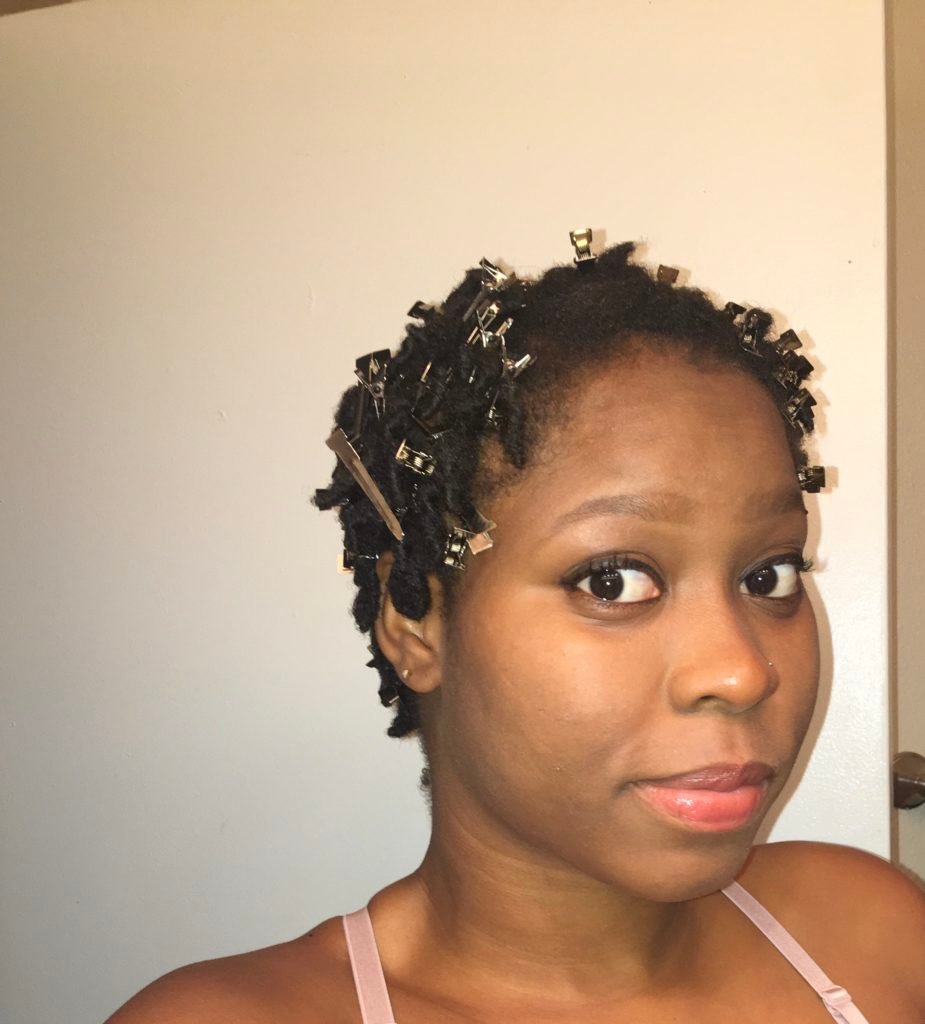Image of Shanice wearing single prong clips used to retwist starter locs.