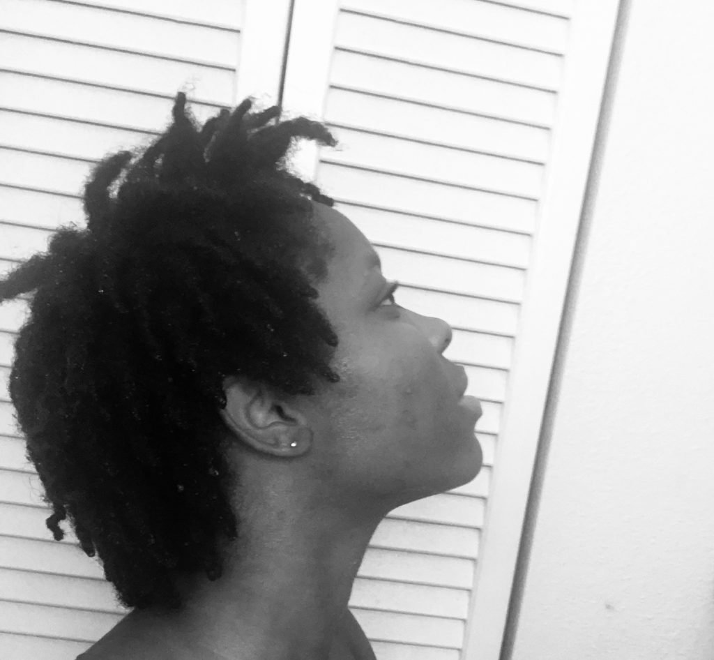 How to wash starter locs. Woman with wet locs. 